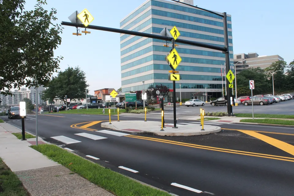 Two-lane street with pedestrian crossing island